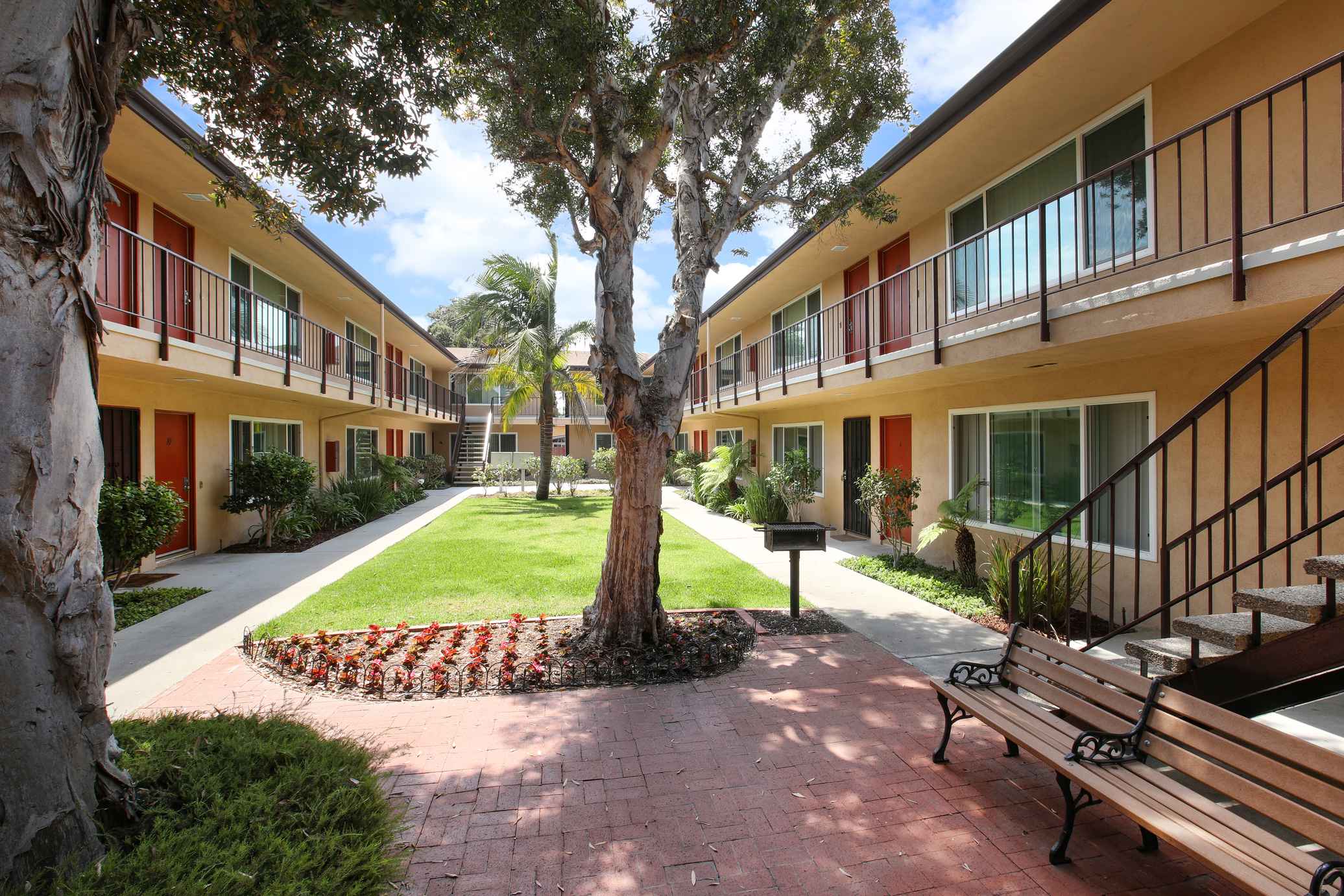 Armada Apartments shaded brick patio with community seating